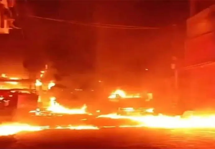   FLAMES engulf the motorcycles parked beneath the PMT pole in Hyderabad  locality.&mdash;Umair Ali  