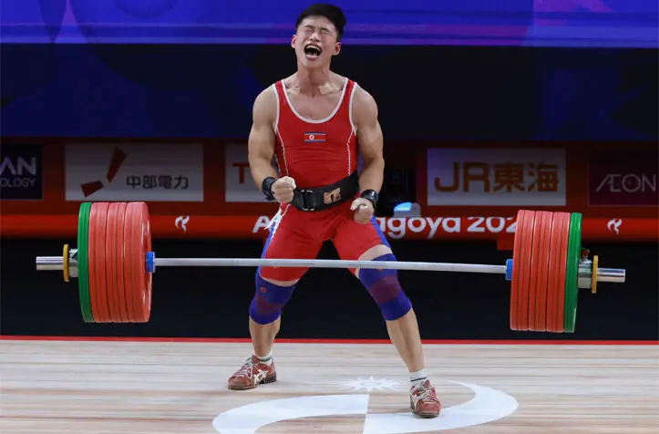 NAGOYA: North Korea’s Ri Won Ju reacts as he competes in the Asian Games men’s 70kg weightlifting final at the Nagoya City Trade and Industry Centre on Saturday.—AFP
