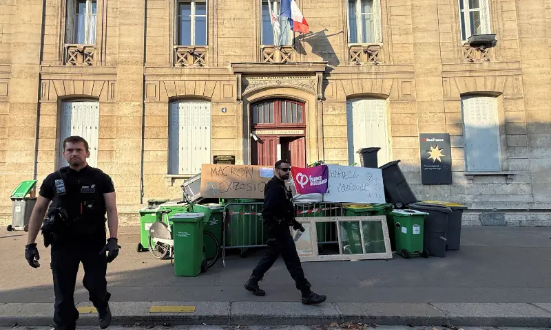 French police walk past the entrance of the Lycee Arago high school blocked by French high school students in Paris as part of a day of strikes and protests by public sector workers, including firefighters, in France, on September 29, 2026. — Reuters