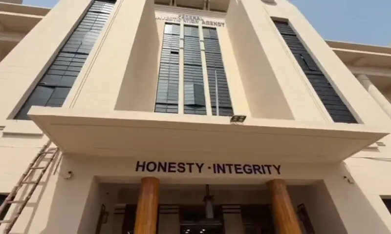 Screen grabs from a video showing the facade of the Cotton Exchange building, which now houses offices of the Federal Investigation Agency.—Dawn