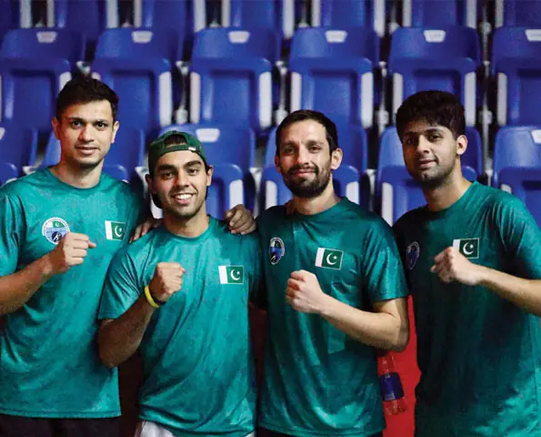 NAGOYA: Pakistan players pose for a photo following their win over South Korea in the men’s team squash quarter-final at Nagoya Kinjo Futo Arena on Wednesday.—Courtesy POA
