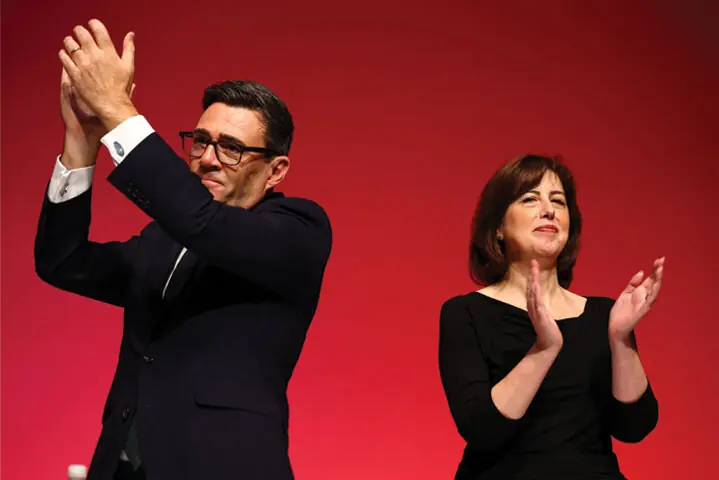 BRITISH PM Andy Burnham and Secretary of State for Education Lucy Powell applaud at the end of the Labour Party’s annual conference.—Reuters