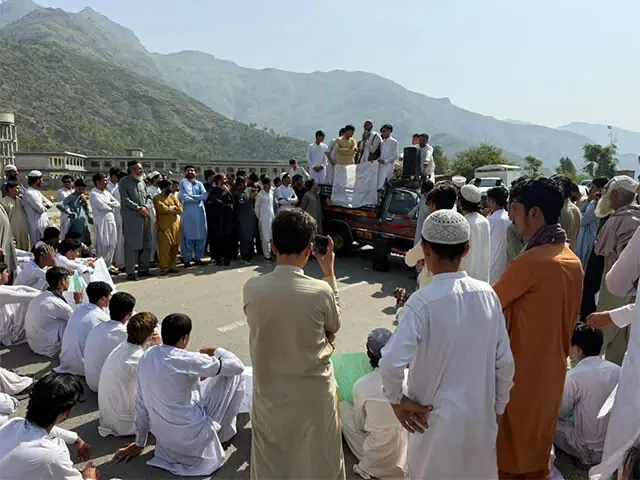 Students and local residents stage a protest demonstration in Barang, Bajaur, on Thursday. — Dawn