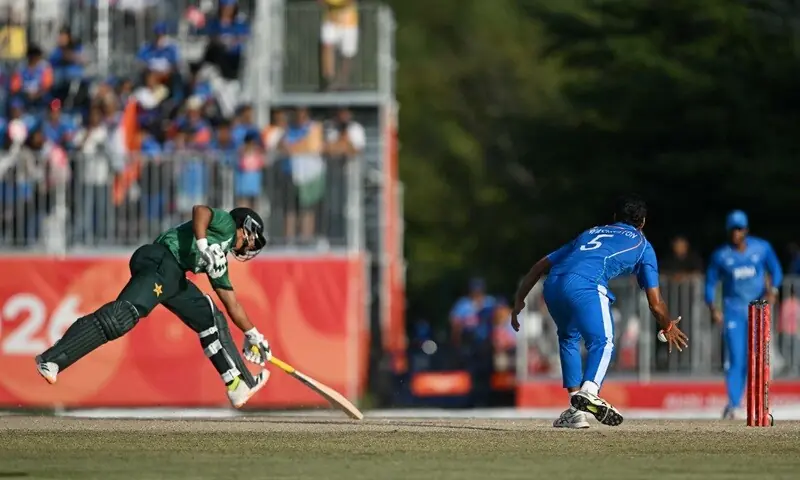 Pakistan’s Saim Ayub (L) makes it to the crease to avoid a runout during the men’s cricket final match between Pakistan and India during the 2026 Asian Games at the Korogi Athletic Park in Nisshin on October 3, 2026.