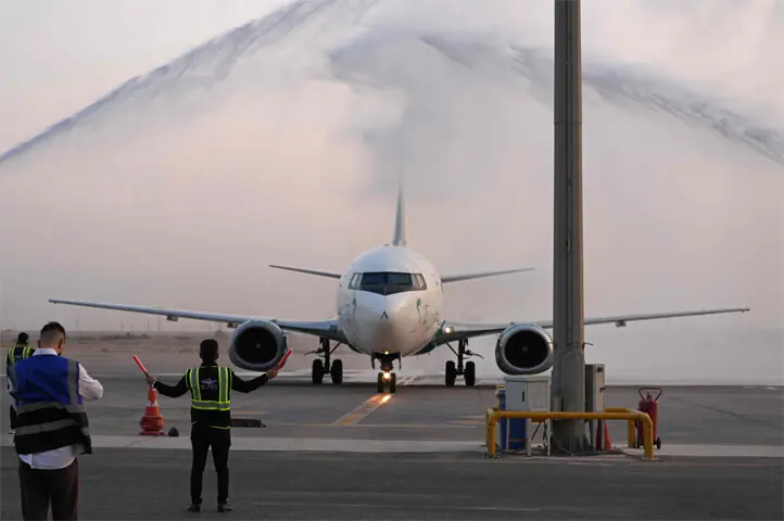  A plane operated by Iranian carrier Caspian Airlines receives a water cannon salute upon landing at Al-Najaf Al-Ashraf International Airport.&mdash;AFP 