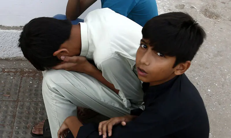  More family members mourn the loss of their loved ones.&mdash;Shakeel Adil / White Star 