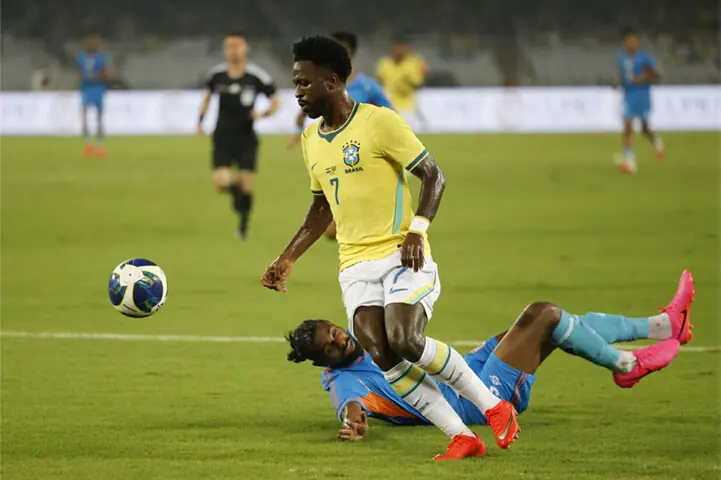 KOLKATA: Brazil’s Vinicius Junior dribbles past Bijoy Varghese of India during their international friendly at the Salt Lake Stadium.—Reuters