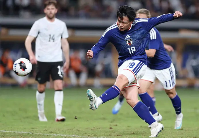  JAPAN&rsquo;S Ayase Ueda shoots to score against New Zealand during the Kirin  Cup final at the MUFG Stadium on Monday.&mdash;AFP 