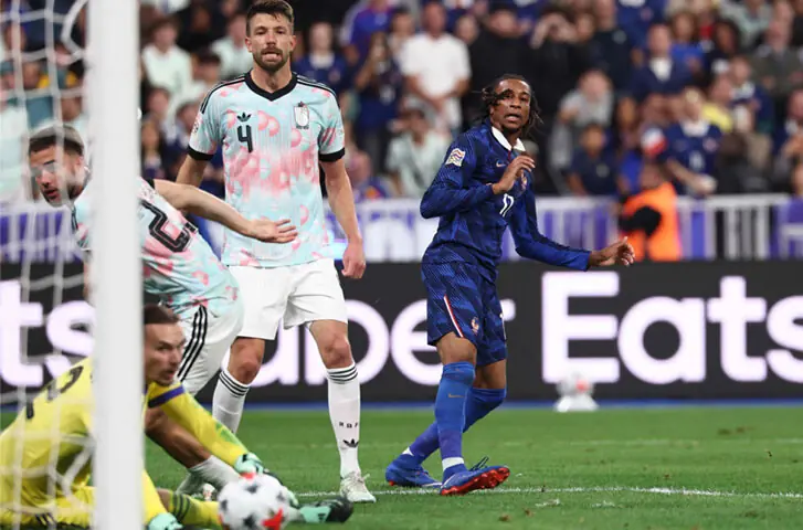 PARIS: France’s Michael Olise (R) scores past Belgium goalkeeper Maarten Vandevoordt during their UEFA Nations League Group A1 match at Stade de France.—AFP