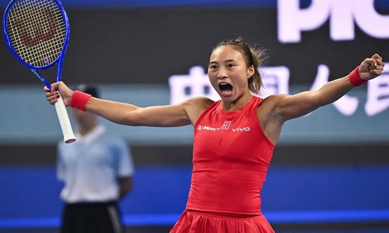 China’s Zheng Qinwen celebrates after beating Armenia’s Alina Charaeva in their China Open round-of-16 match at the National Tennis Centre in Beijing, China, on October 7, 2026. —AFP