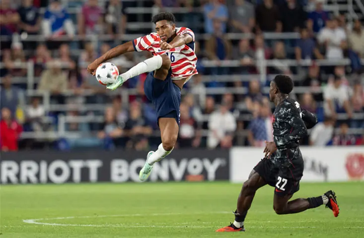  ST PAUL (Minnesota): Alex Freeman of the US controls the ball as Canada&rsquo;s Richie Laryea looks on during their international friendly at Allianz Field.&mdash;Reuters 