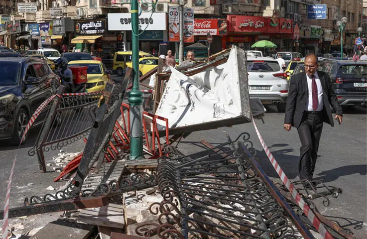  A man walks past the Palestinian martyrs&rsquo; memorial destroyed by the Israeli military in the occupied West Bank city of Nablus.&mdash;AFP 