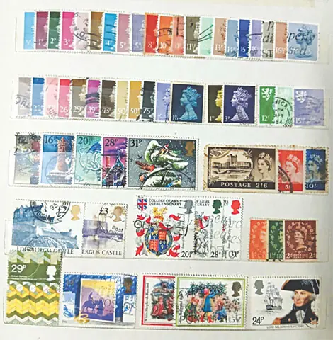 Matching series and sets of stamps from England arranged in a stamps album