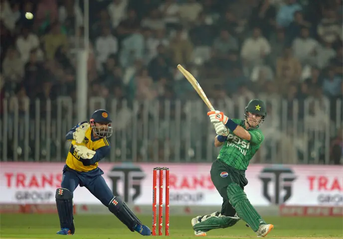 PAKISTAN batter Maaz Sadaqat plays a lofted stroke as Sri Lankan captain Kusal Mendis looks on during the first T20 International at the Rawalpindi Cricket Stadium on Friday.—Tanveer Shahzad/White Star