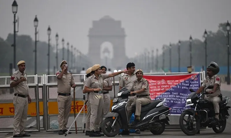 Delhi Police personnel stand guard ahead of a protest by the youth-led Cockroach Janata Party (CJP) demanding the resignation of India’s Chief Election Commissioner over alleged “special intensive revision” (SIR) voter-roll irregularities, near the India Gate in New Delhi on October 10, 2026. — AFP