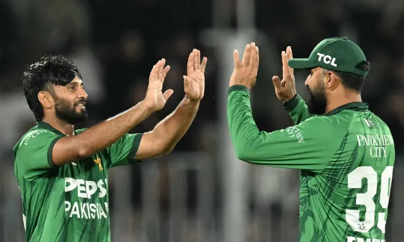 Pakistan’s Imran Randhawa (L) and Fakhar Zaman (R) celebrate during the second Twenty20 International against Sri Lanka at the Rawalpindi Cricket Stadium in Rawalpindi on October 11, 2026.—AFP