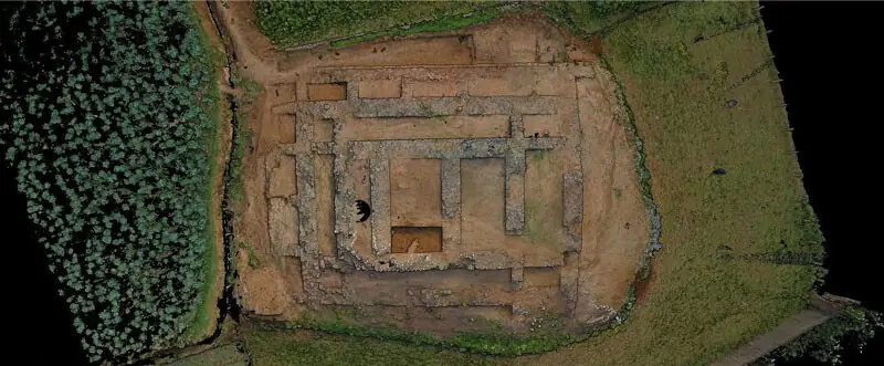 An aerial view of the Jandial site. (Right) Workers busy in excavation. — Dawn
