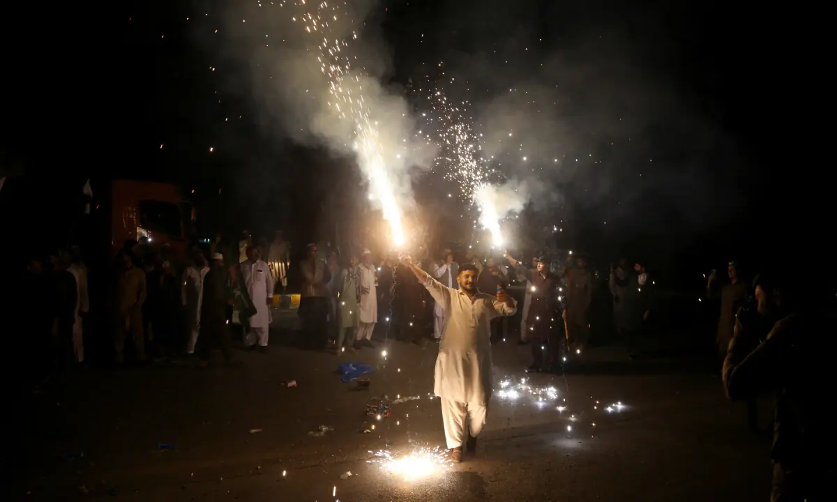 A PML-N supporter in Peshawar sets off fireworks, celebrating the imposition of emergency and governor&rsquo;s rule in KP on October 12, 2026. &mdash; Reuters
