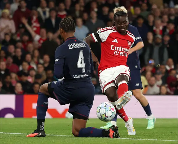 LONDON: Arsenal’s Bukayo Saka scores during the match against Lille at the Emirates Stadium.—AFP