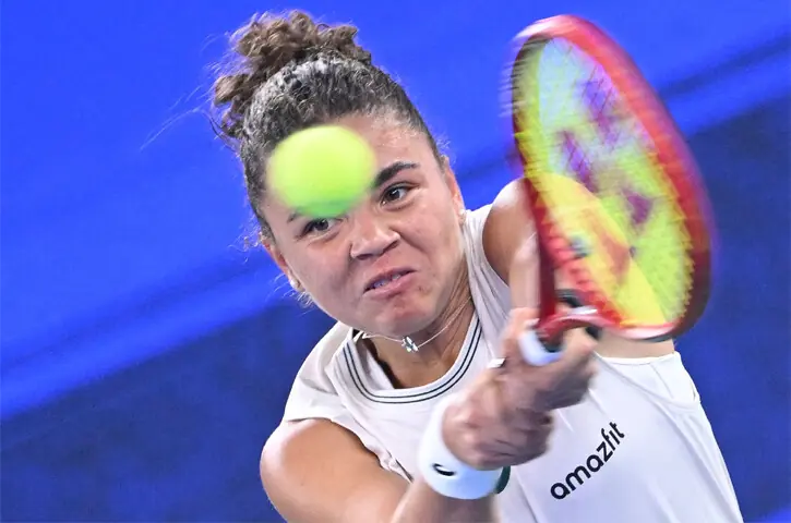 WUHAN: Italy’s Jasmine Paolini hits a return to Sonay Kartal of Britain during their Wuhan Open match on Thursday.—AFP