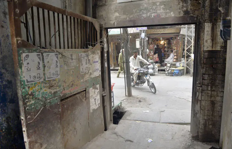The residential locality of Bhabara Bazaar is surrounded by gates. Iron gates were installed around the locality in the past to ensure the safety of residents. — Photos by Tanveer Shahzad