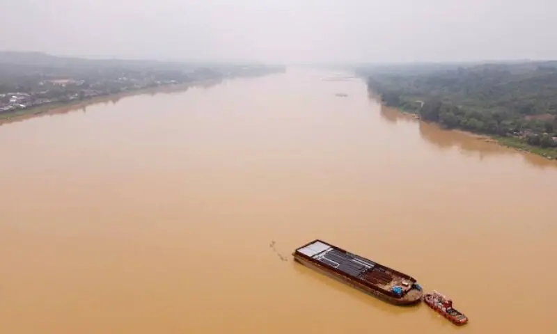 A drone view shows a tugboat alongside a cargo barge loaded with metal pipes, stuck on the Kapuas River, as water levels recede amid a prolonged El Nino-induced drought in Sanggau Regency, West Kalimantan province, Indonesia, September 30, 2026. &mdash;Reuters