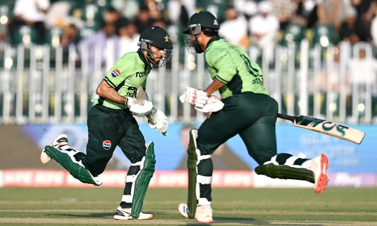 Pakistan’s Arafat Minhas (L) and Faheem Ashraf run between the wickets.—AFP