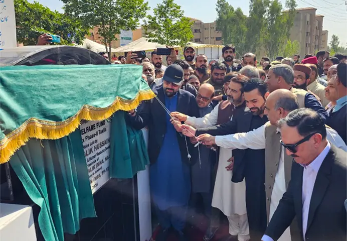 Federal Minister for Overseas Pakistanis and Human Resource Development Chaudhry Salik Hussain lays the foundation stone of Phase II of the Workers’ Welfare Fund Labour Complex near Taxila on Tuesday. — Dawn