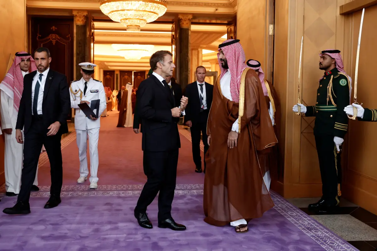 Saudi Crown Prince Mohammed Bin Salman accompanies French President Emmanuel Macron after a meeting at the Al Yamamah Palace in Riyadh, Saudi Arabia, on October 21, 2026. &mdash; Reuters