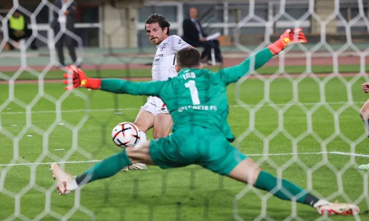 Bayer Leverkusen&rsquo;s Jonas Hofmann (L) scores past OFI Crete goalkeeper Klidman Lilo during their UEFA Europa League first-round match at the Pankritio Stadium in Heraklion, Greece, on October 22, 2026. &mdash;AFP