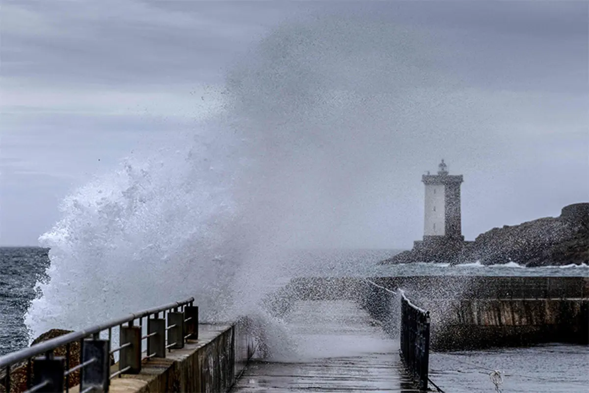 WAVES crash on a jetty at Le Conquet as a storm approaches France.—AFP