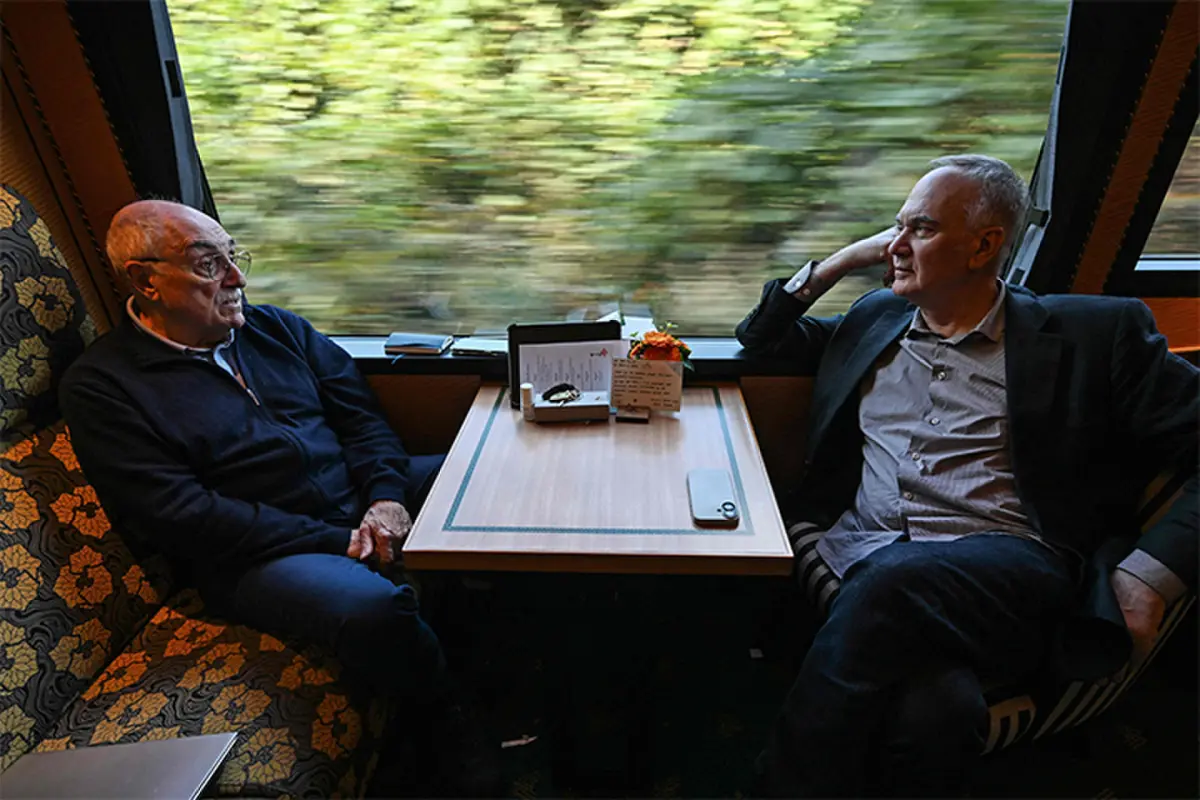 WRITERS Herve Le Tellier and Richard Collasse, aboard a train, face the unusual task of collectively writing a novel in under 24 hours.—AFP