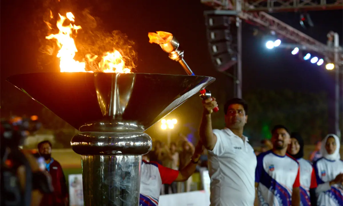 Star javelin thrower Arshad Nadeem lights the torch during the opening ceremony on Thursday.—White Star