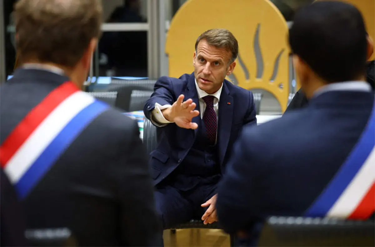   French President Emmanuel Macron meets elected officials at the town hall following the shooting.&mdash;AFP  