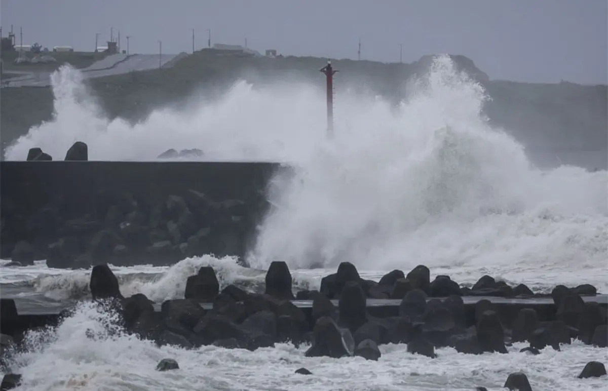   WAVES crash against concrete wave breakers along the coast as Typhoon Champi approaches Taiwan.&mdash;AFP  