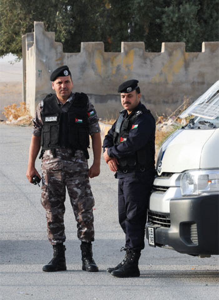 Security personnel stand outside the Greek Orthodox Church in Hamoud.—Reuters