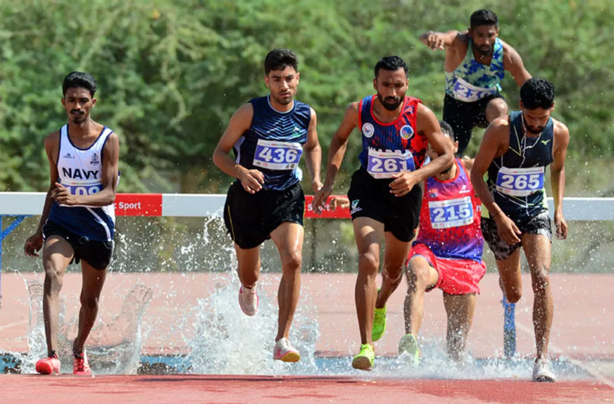  HEC&rsquo;S Khubaib (second L) competes during the 3000m steeplechase final of the National Athletics Championship at the NED University on Saturday.&mdash;Tahir Jamal/White Star 