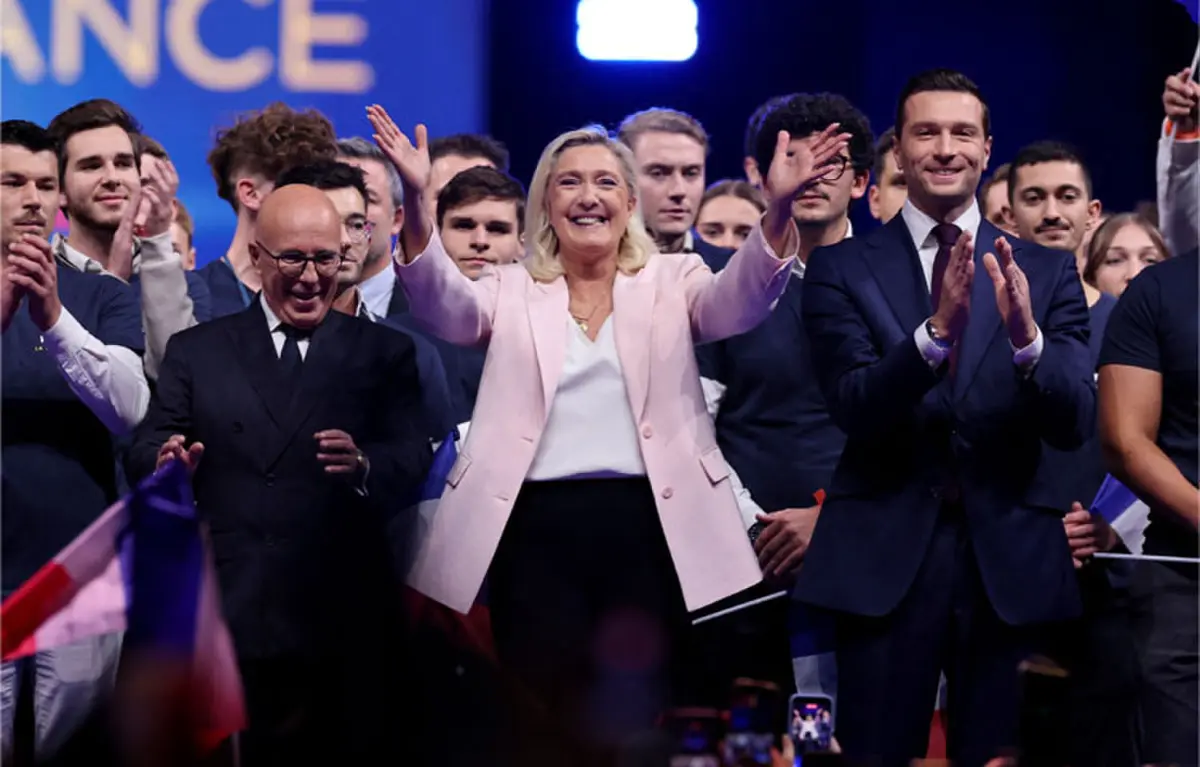   Far-right leader Marine Le Pen greets party workers during a political rally to launch the presidential campaign in Orleans, France.&mdash;Reuters  