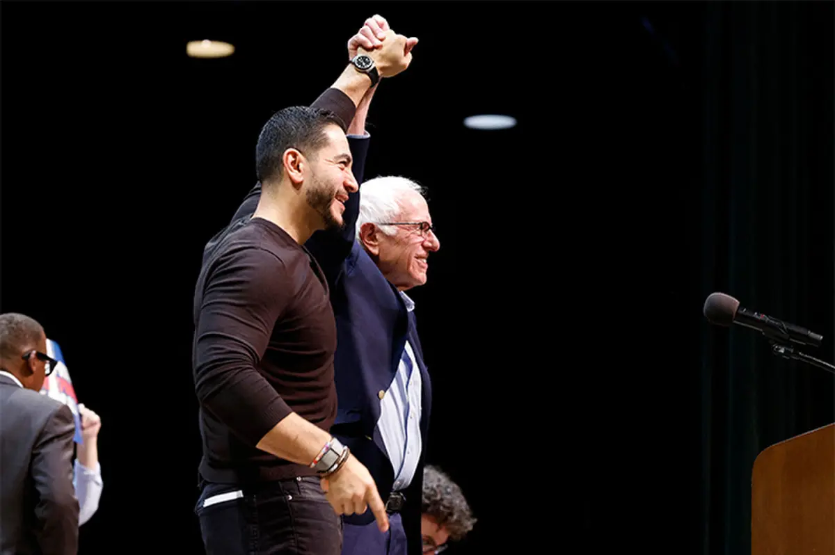   Senator Bernie Sanders joins hands with Democrat senatorial candidate Abdul El-Sayed at a campaign rally  in Grand Rapids, Michigan.&mdash;AFP  