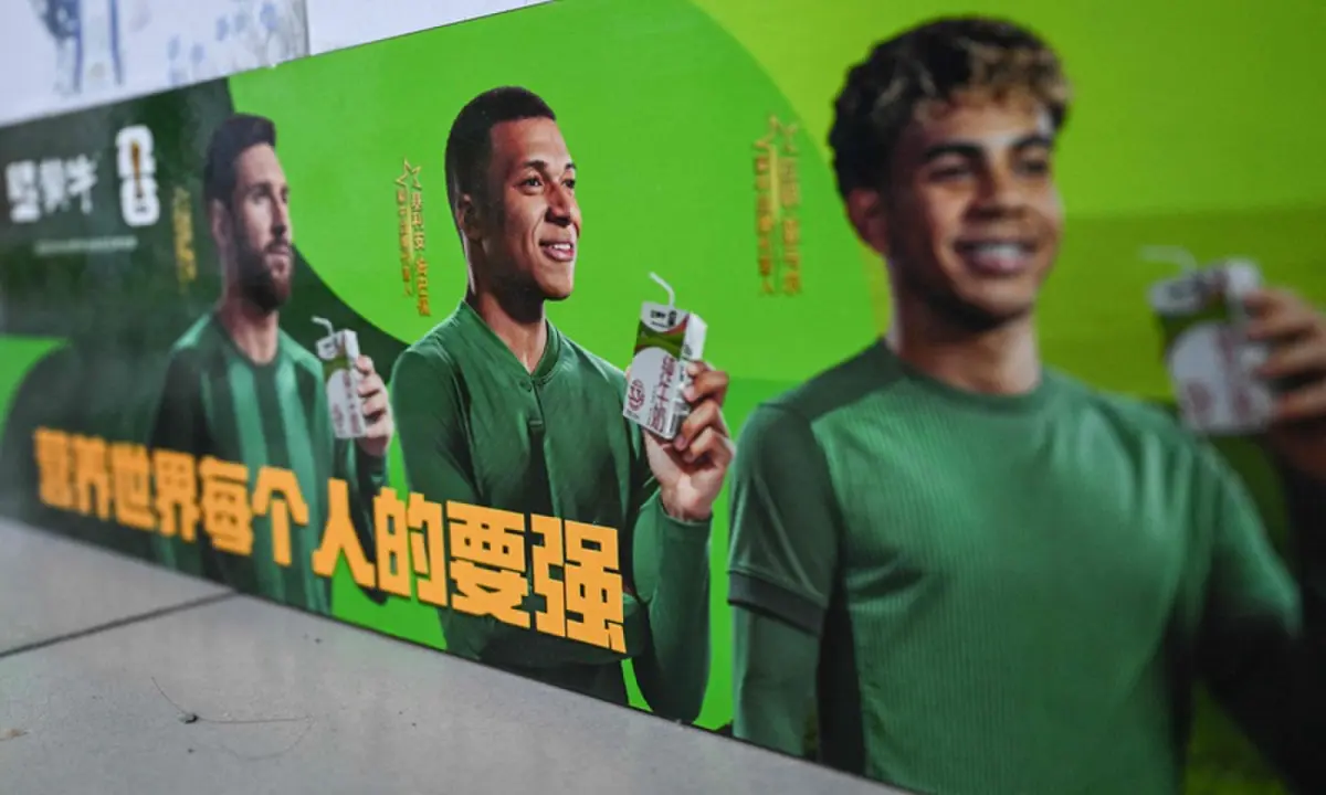 This photo shows an advertising campaign for Chinese dairy brand ‘Mengniu’ featuring France’s Kylian Mbappe (C), Argentina’s Lionel Messi (L) and Spain’s Lamine Yamal at a supermarket in Beijing, China, on October 28, 2026. —AFP