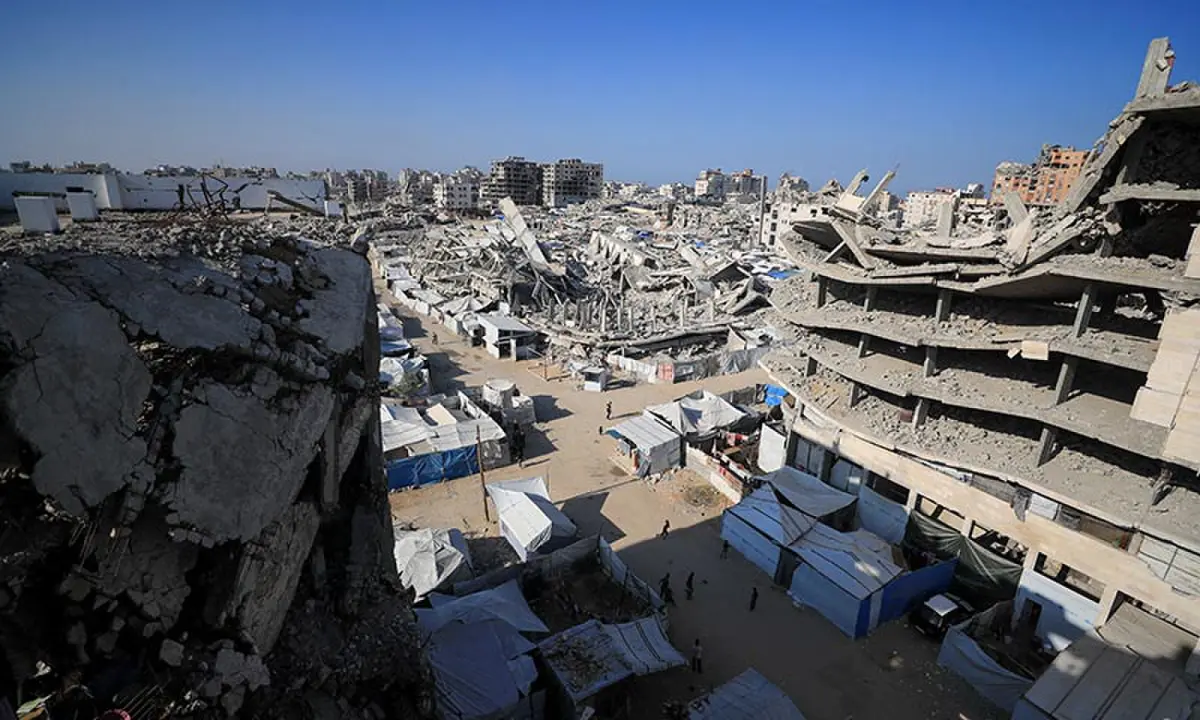 Palestinians walk near the rubble of buildings destroyed during the war in Gaza City on October 28, 2026. — Reuters