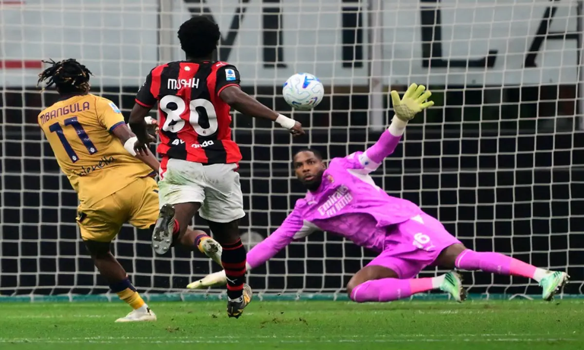 Bologna&rsquo;s Samuel Mbangula (L) scores past AC Milan goalkeeper Mike Maignan during their Italian Serie A match at San Siro in Milan on October 28, 2026. &mdash;AFP