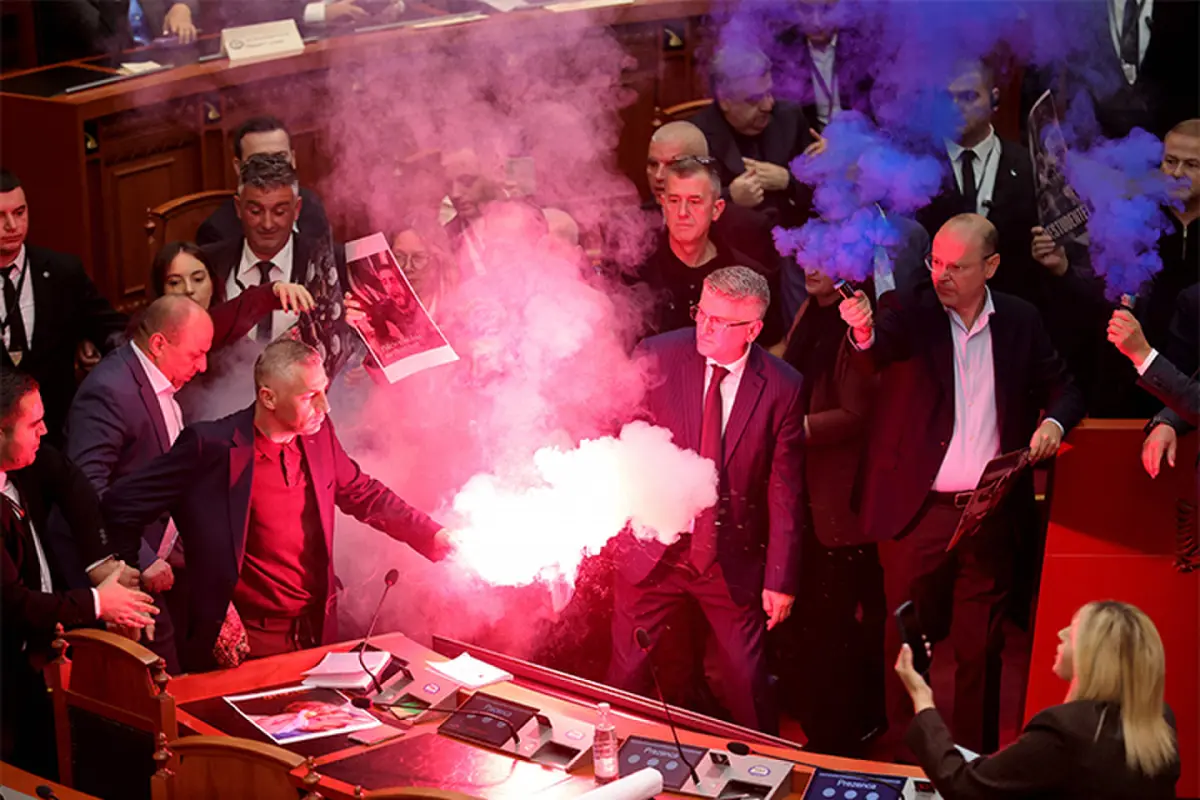 OPPOSITION lawmakers light flares and set off smoke bombs during a session of Albania’s parliament.—AFP