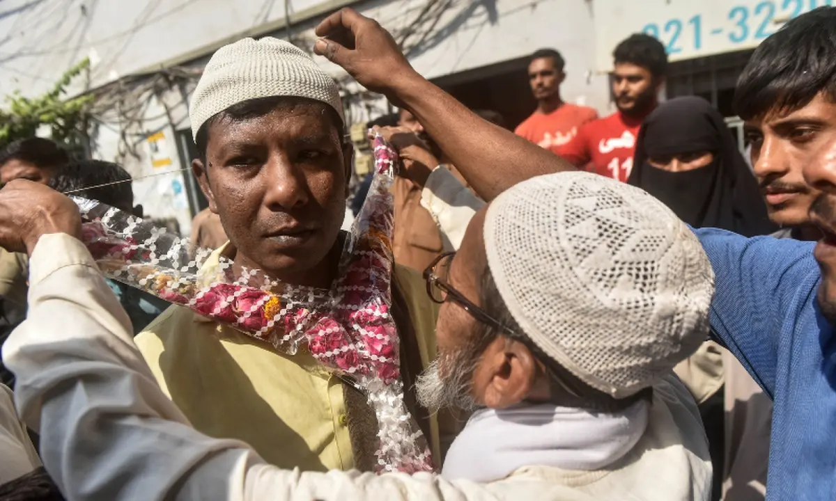 'I will never go back to sea': 11 fishermen released from Indian captivity reunite with families in Karachi