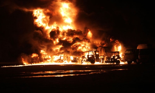 Militants torch at least a dozen Nato oil tankers in Hub