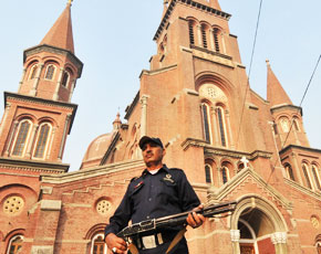 A security guard stands in front of the Sacred Heart Cathedral church in Lahore. -Photo by AFP