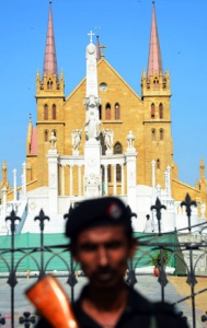 A policeman stands guard outside the St Patrick Church in Karachi. -Photo by AFP