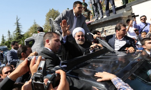 Shoe thrown as Rouhani returns after historic Obama call