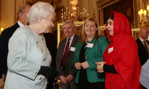 Malala all smiles as she meets Queen Elizabeth