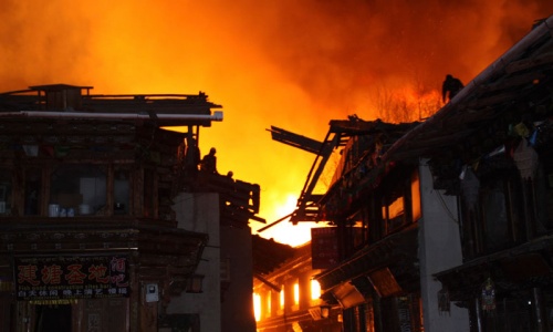 Night fire destroys ancient Tibetan town in China